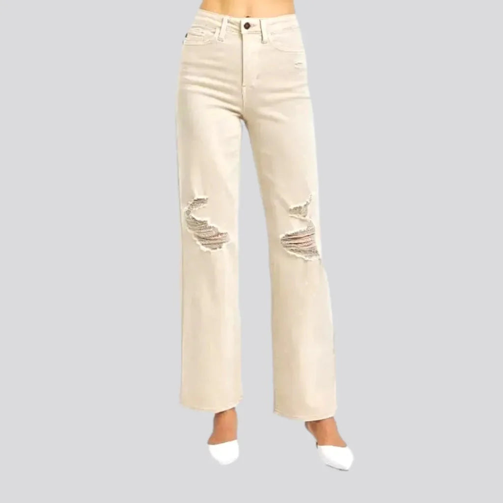 Distressed women's sand jeans